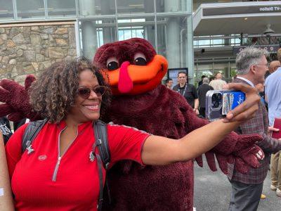 woman taking a selfie with HokieBird