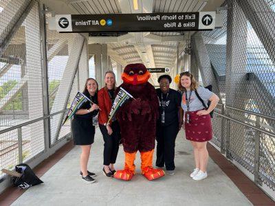 women and HokieBird